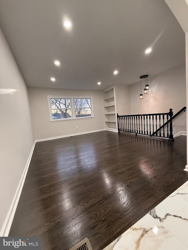 living room with dark hardwood / wood-style flooring