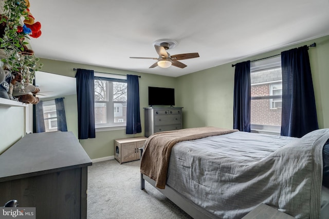 bedroom featuring ceiling fan and light colored carpet