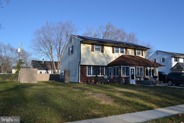 view of front of home with a front lawn