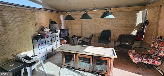 home office featuring tile patterned floors and lofted ceiling