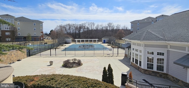 view of swimming pool featuring a fenced in pool, a patio area, and fence