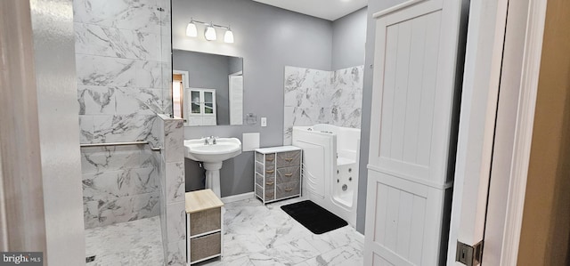 full bath featuring walk in shower, a garden tub, and marble finish floor