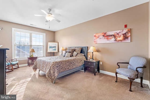 bedroom with light colored carpet and ceiling fan