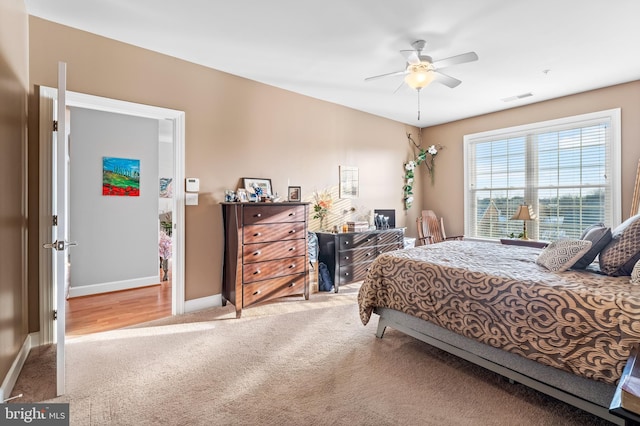 carpeted bedroom with ceiling fan