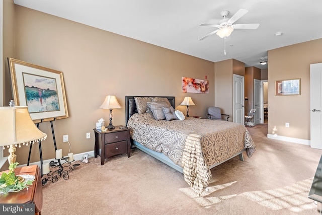 bedroom with light carpet, ceiling fan, and a closet