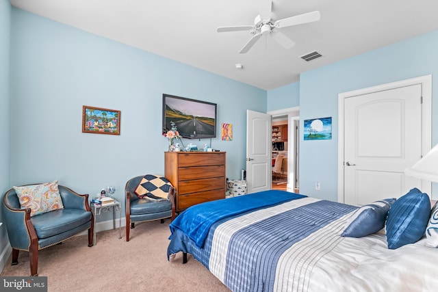 bedroom with light carpet and ceiling fan