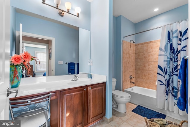 full bathroom featuring vanity, toilet, tile patterned flooring, and shower / bath combo