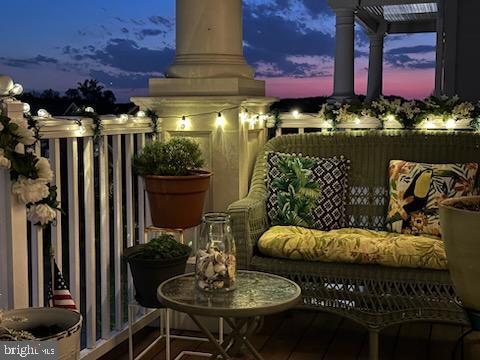 view of balcony at dusk