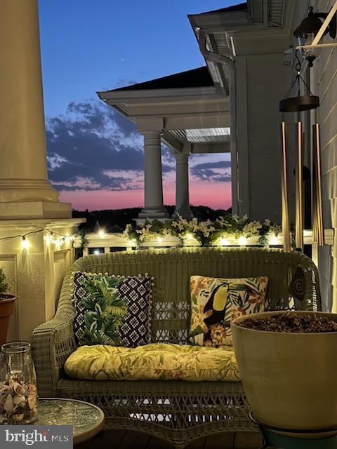 view of balcony at dusk