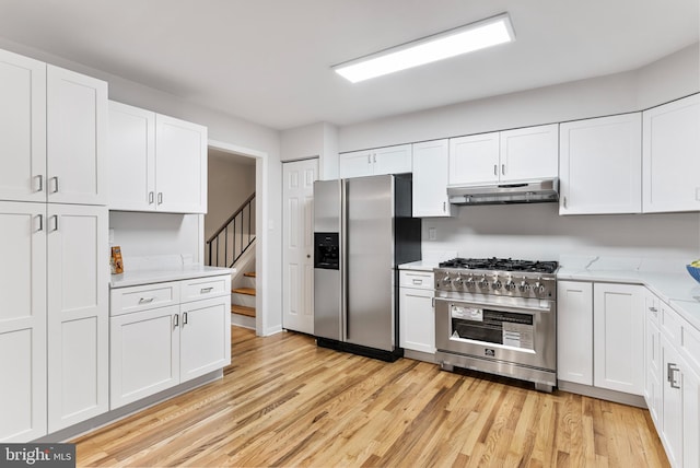 kitchen featuring appliances with stainless steel finishes and white cabinets