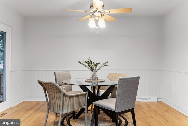 dining space featuring hardwood / wood-style flooring and ceiling fan