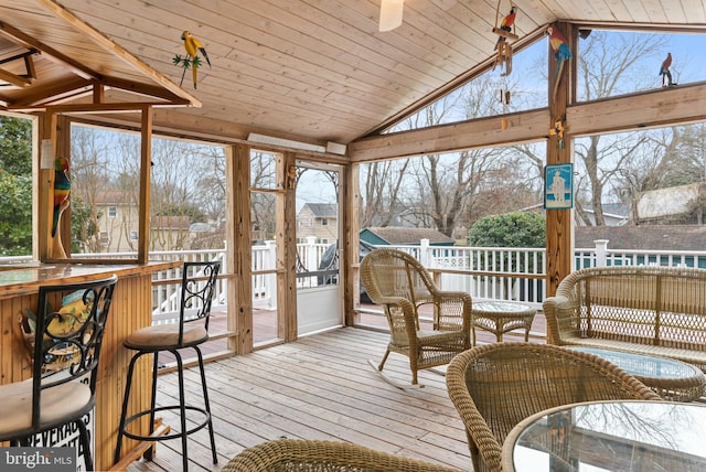 sunroom / solarium with vaulted ceiling and wooden ceiling