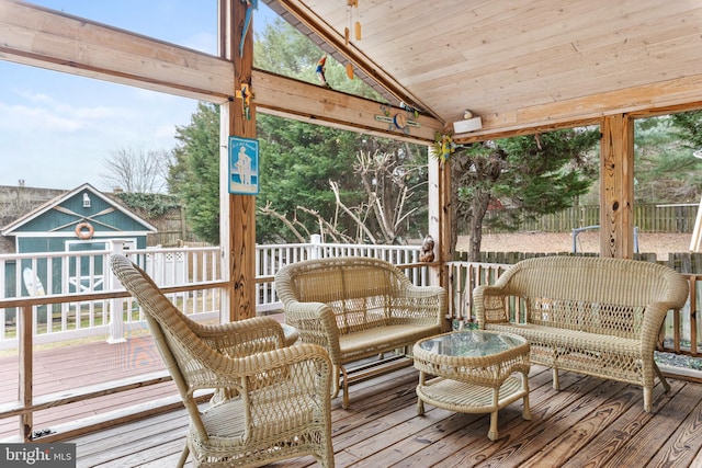 sunroom / solarium with wood ceiling and vaulted ceiling