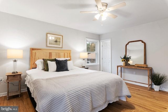 bedroom featuring wood-type flooring and ceiling fan