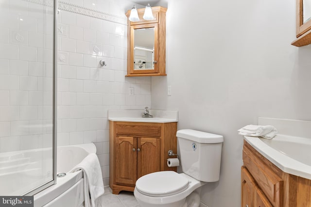 full bathroom with toilet, tile walls, vanity, enclosed tub / shower combo, and tile patterned flooring