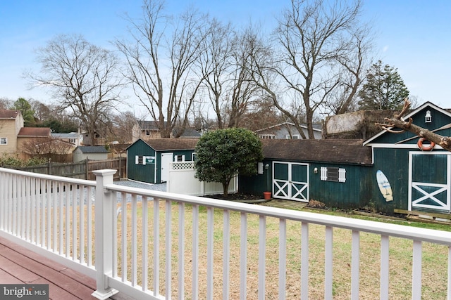 view of front facade with a storage shed and a front yard