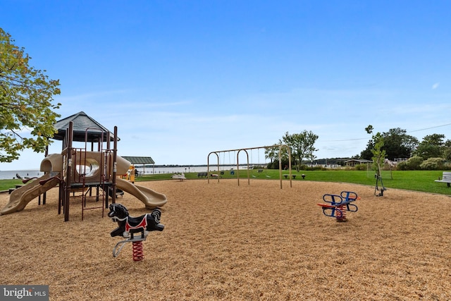 view of jungle gym featuring a water view