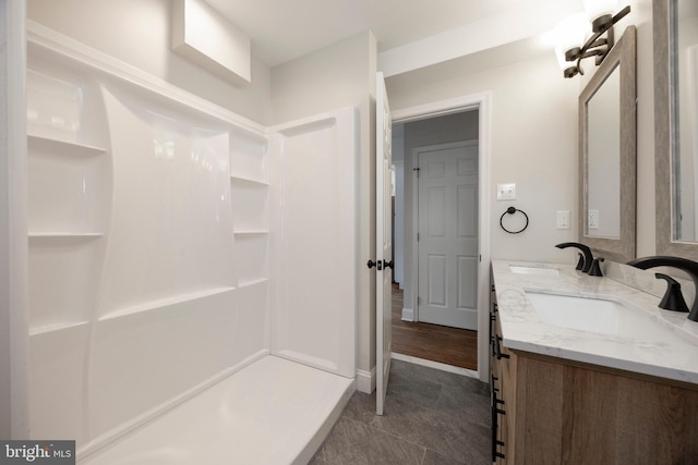 bathroom with vanity and walk in shower