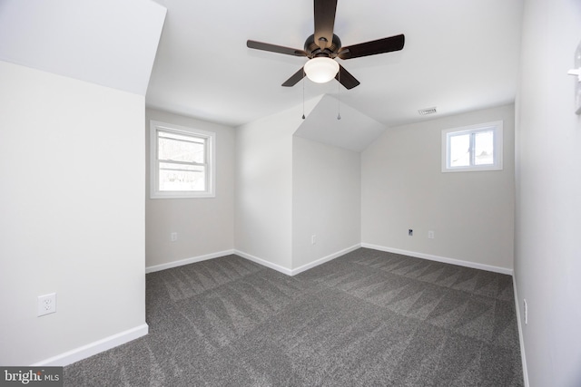 bonus room featuring vaulted ceiling, ceiling fan, and dark carpet