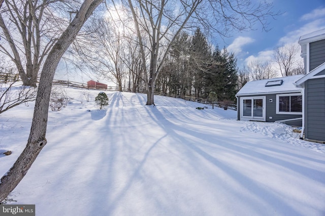 view of yard layered in snow