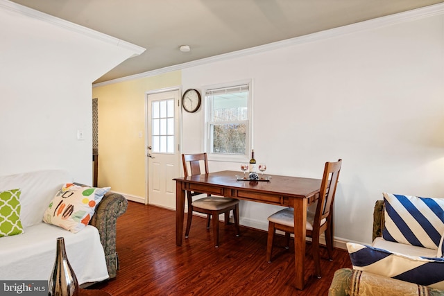 dining room featuring dark wood-type flooring and ornamental molding