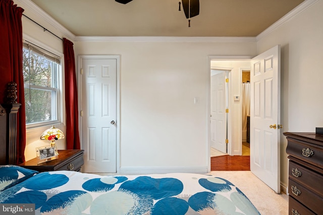 bedroom featuring ceiling fan and crown molding