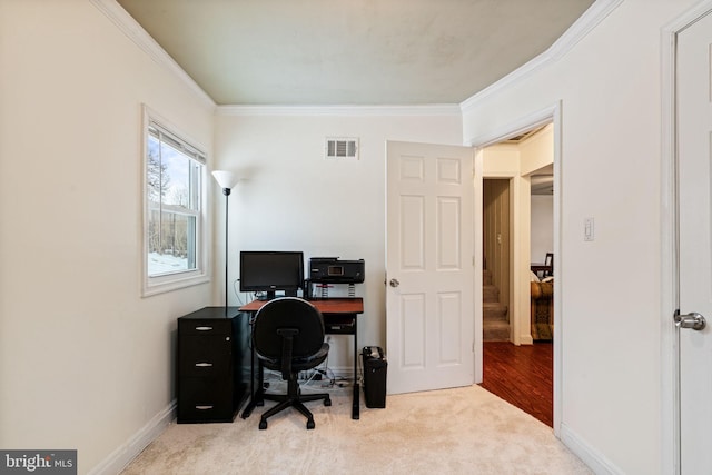 carpeted home office featuring ornamental molding