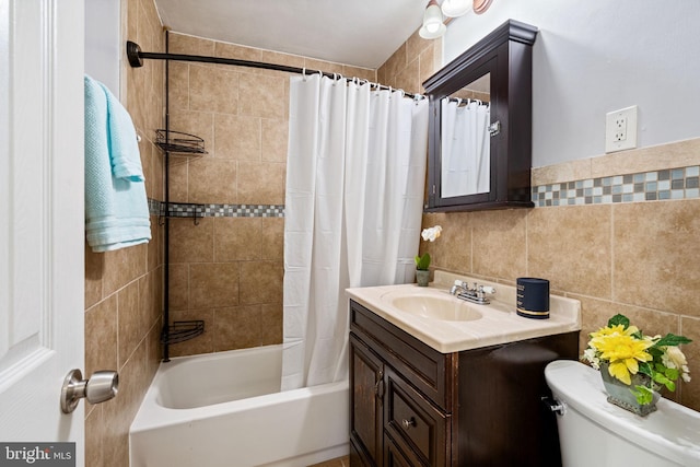 full bathroom with vanity, shower / tub combo, backsplash, tile walls, and toilet