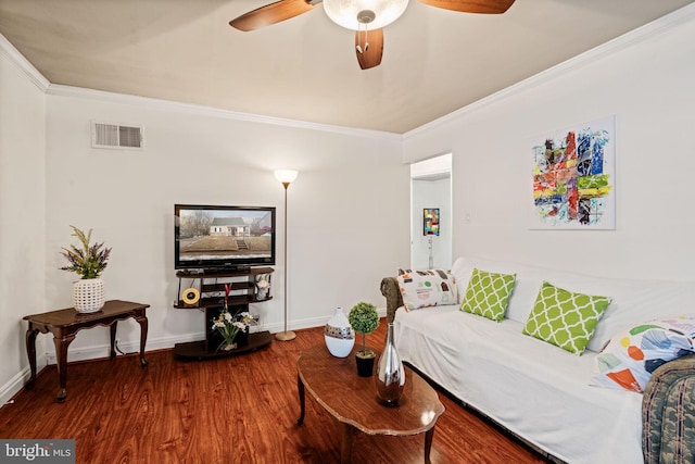 living room featuring ceiling fan, wood-type flooring, and ornamental molding