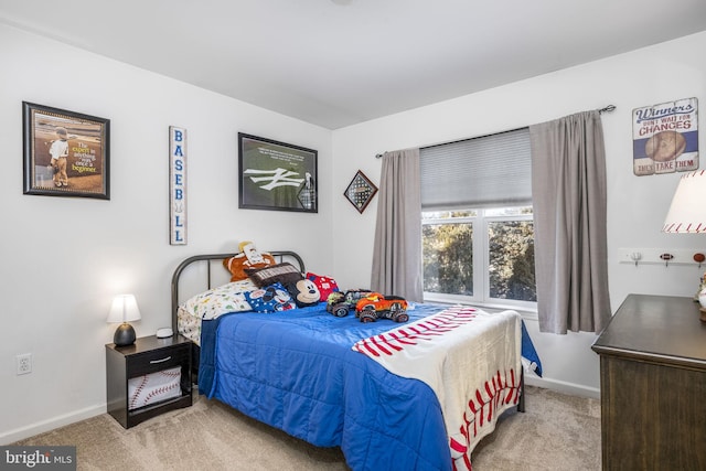 bedroom with light colored carpet