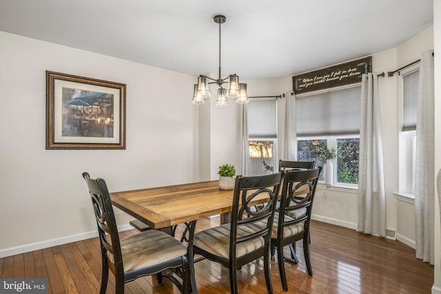 dining space featuring dark wood-type flooring