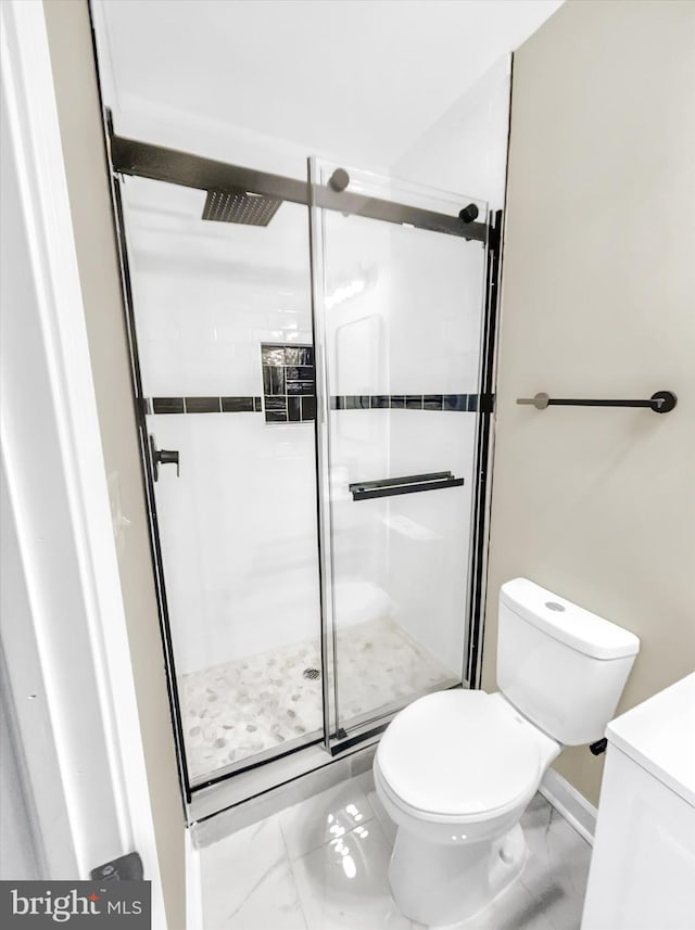 bathroom with toilet and walk in shower