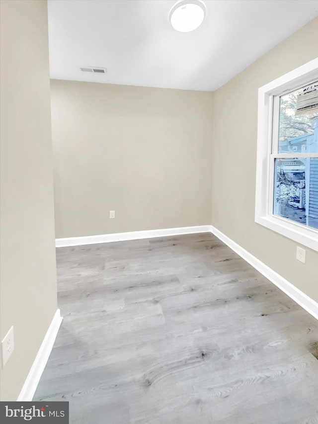 empty room featuring hardwood / wood-style floors