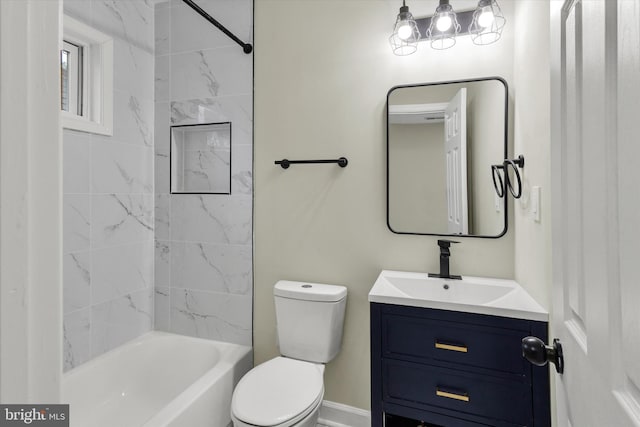 full bathroom featuring vanity, toilet, and tiled shower / bath combo