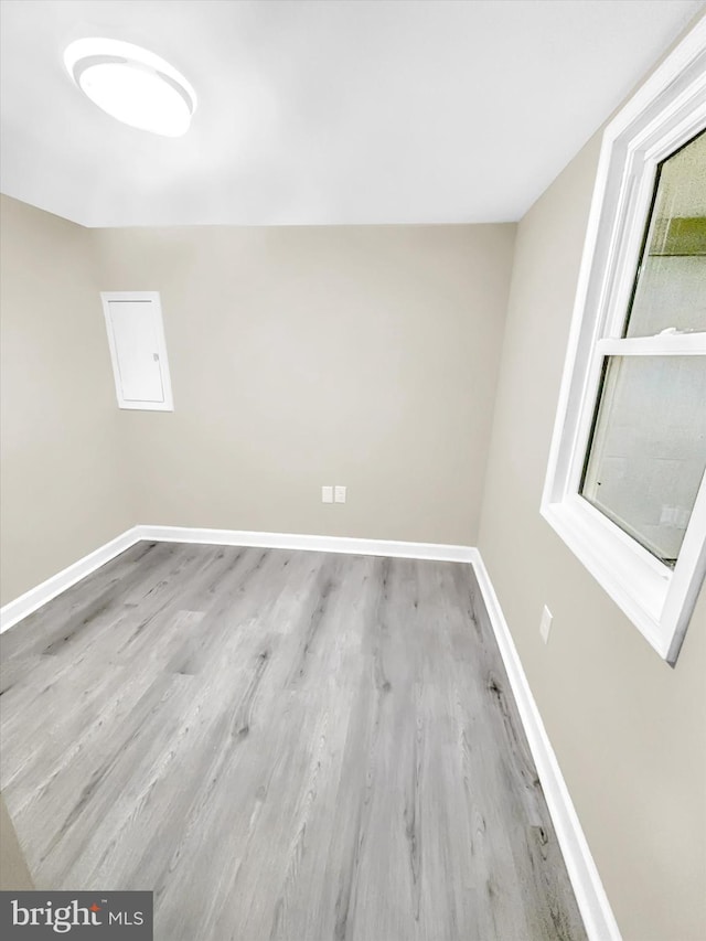 unfurnished room featuring light hardwood / wood-style floors