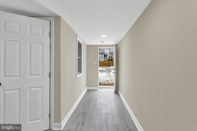 hall with light hardwood / wood-style flooring