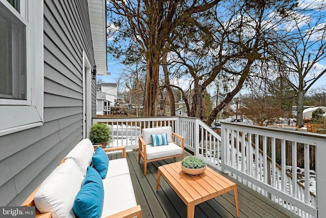 snow covered deck with outdoor lounge area