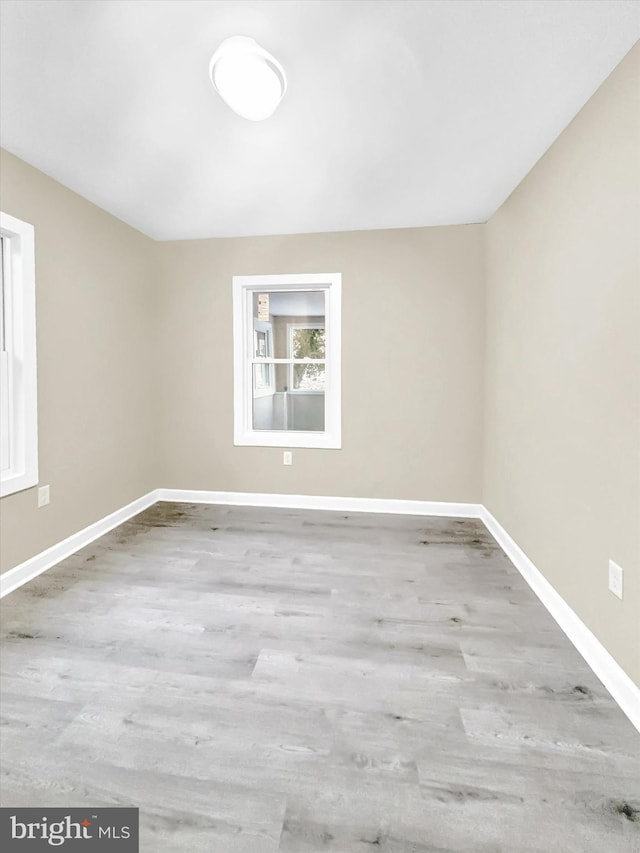 spare room featuring light hardwood / wood-style floors