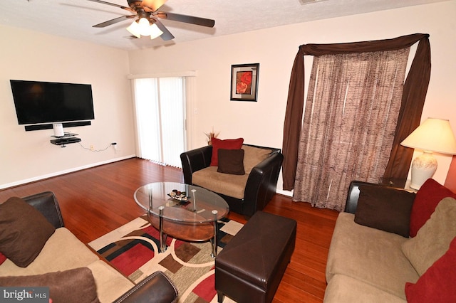 living room with ceiling fan and hardwood / wood-style floors