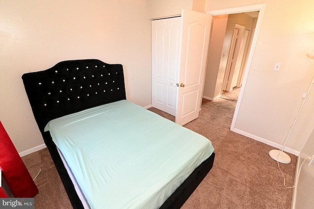 carpeted bedroom with a closet