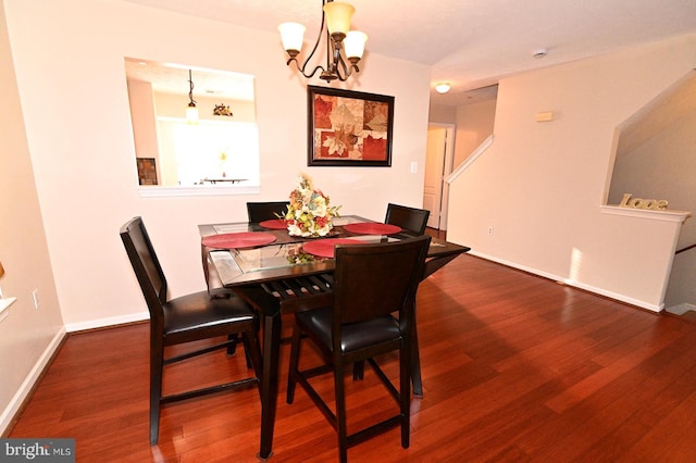 dining room featuring a chandelier and hardwood / wood-style floors