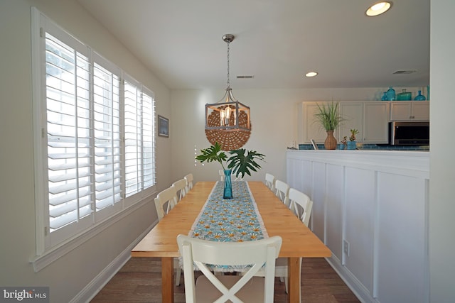 dining area with wood-type flooring