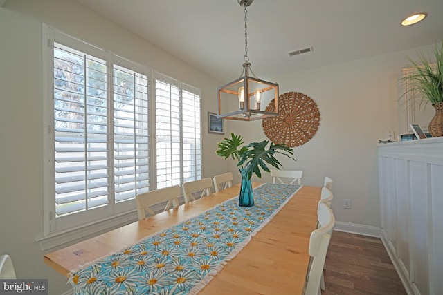 dining area featuring dark wood-type flooring