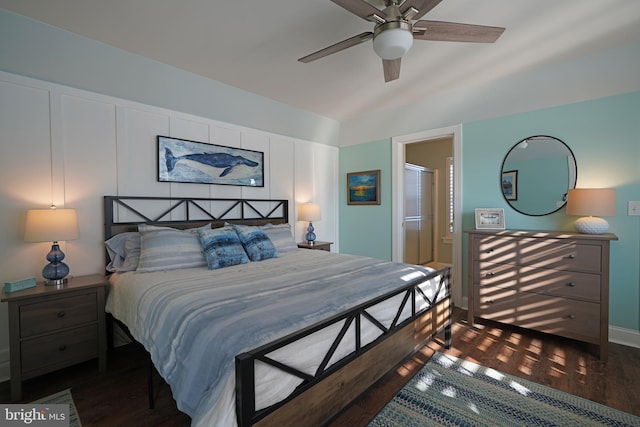 bedroom featuring ceiling fan, ensuite bathroom, and dark hardwood / wood-style floors