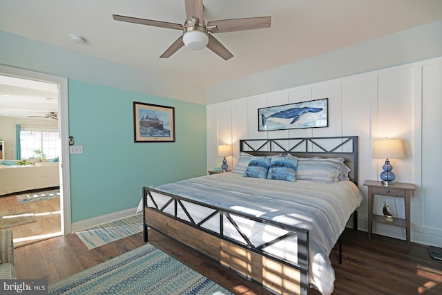 bedroom featuring ceiling fan and dark hardwood / wood-style flooring