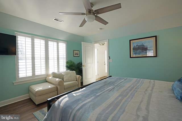 bedroom featuring ceiling fan and dark wood-type flooring