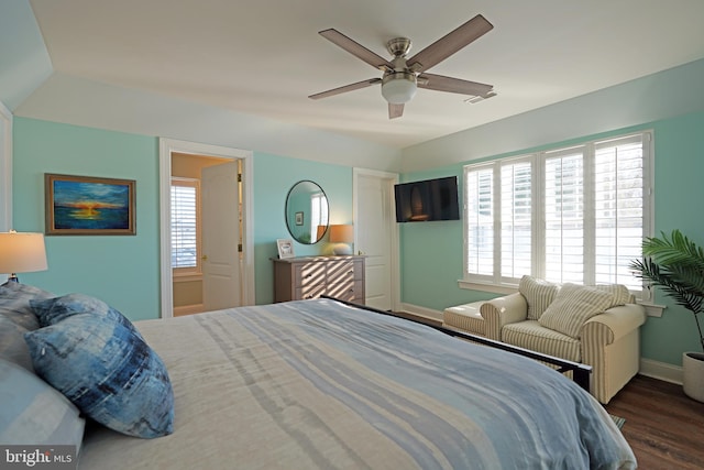 bedroom with dark wood-type flooring, multiple windows, and ceiling fan