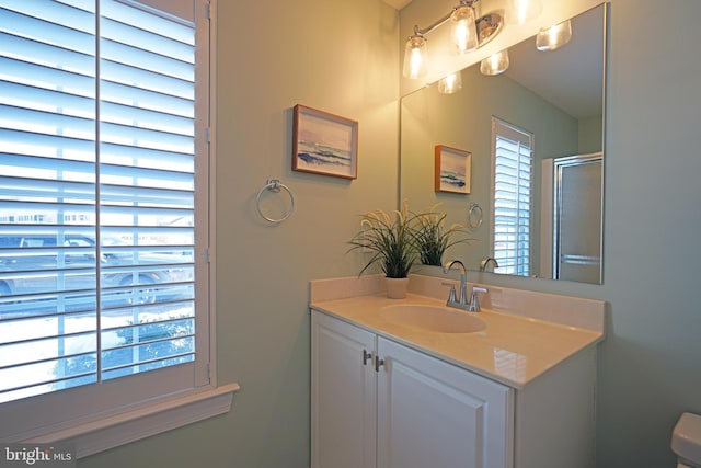 bathroom with vanity and walk in shower