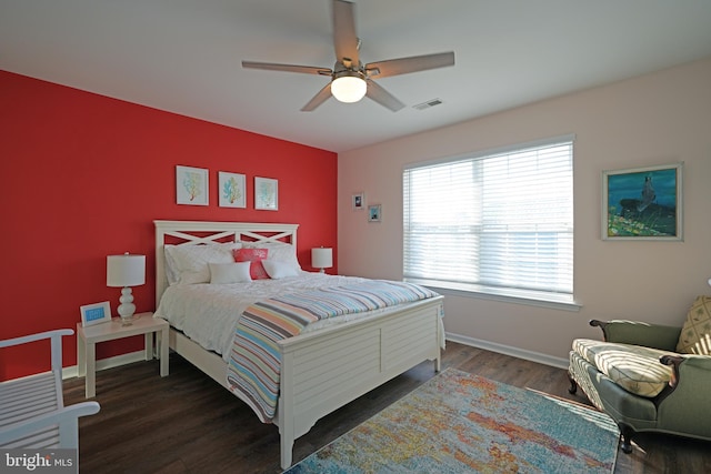 bedroom featuring ceiling fan and dark wood-type flooring