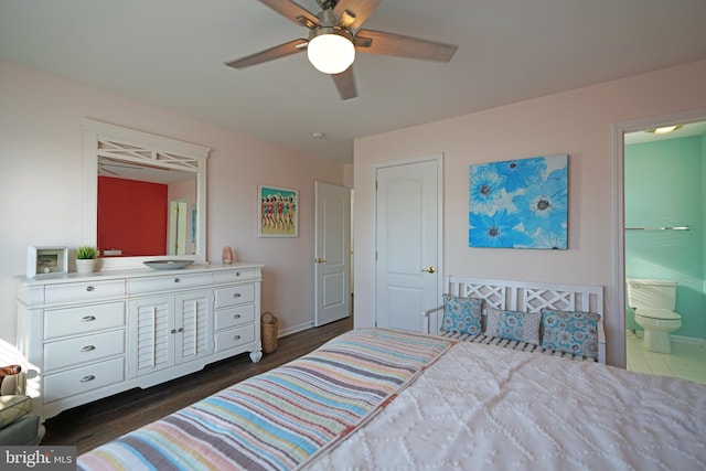 bedroom with ceiling fan, dark wood-type flooring, and ensuite bathroom